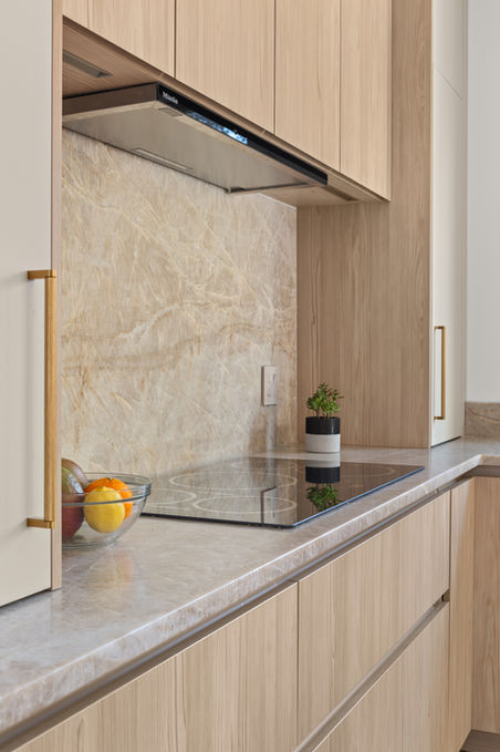 Side angle of modern kitchen stove area.