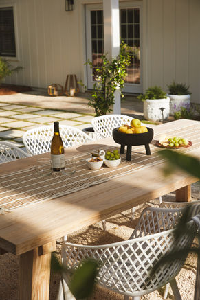 Coastal outdoor dining overlooking a patio area that is great for family dinners or parties.