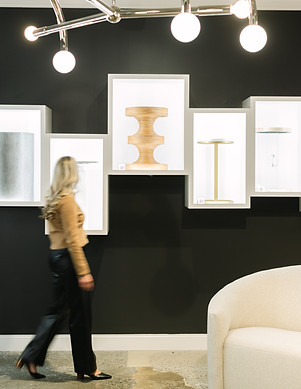 Kalissa Wilson browsing design pieces in a showroom, reflecting the hands-on, thoughtful approach of her interior design process.