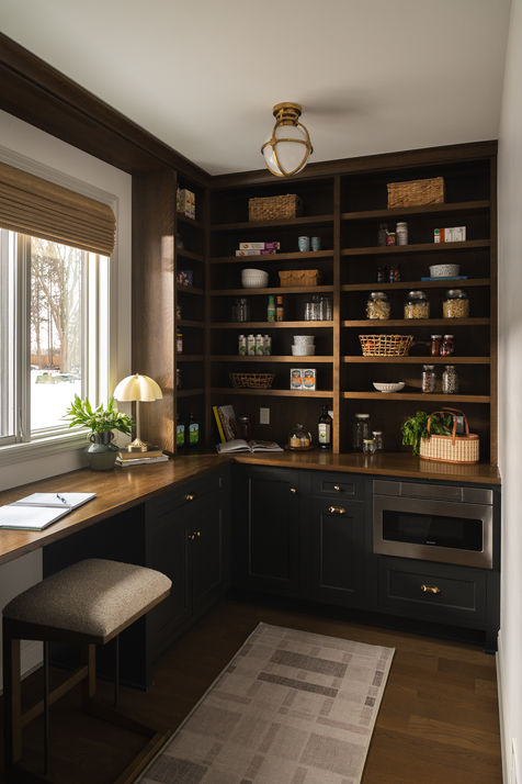 Custom pantry with prep area, built-in microwave, shelving, and desk space in a luxury Rochester, Michigan home