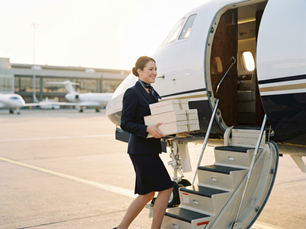 VIP Flight Attendant Boarding a Private Jet with Inflight Catering Order