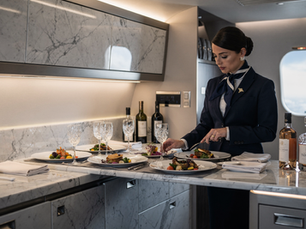 VIP flight attendant preparing food on a private jet