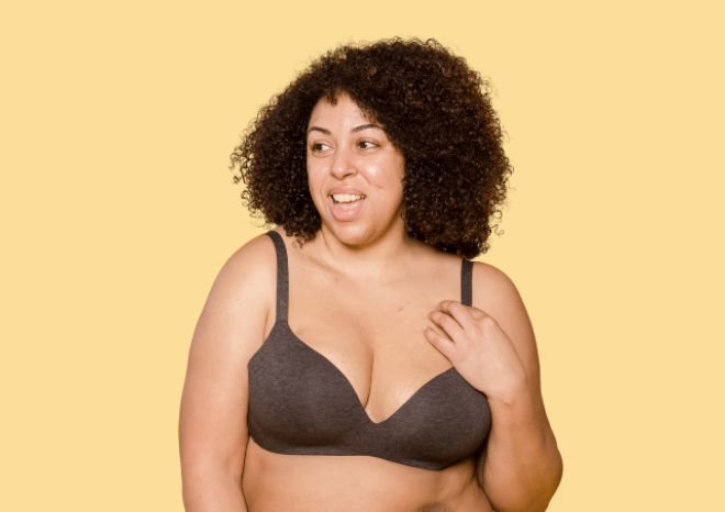 Woman wearing a bra fitted for uneven boobs