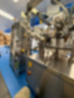 Hot air tube filler machine in action at the production facility, showcasing advanced technology and precision engineering.