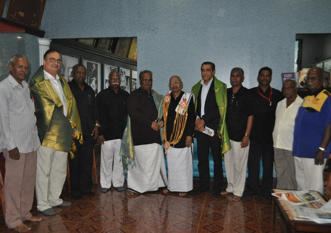 Men in traditional attire and suits, part of a Visual Diplomatic Registry