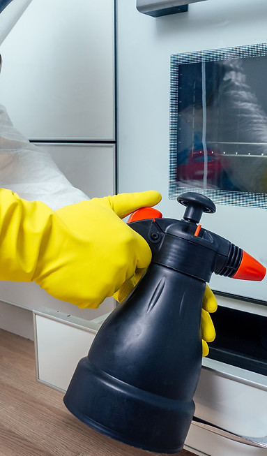 pest-control-worker-standing-with-sprayer-in-kitch-2024-10-30-20-53-46-utc.jpg