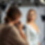A women photographer holding a camera is in a photography studio, with profesinol lighting