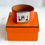 Miniatura: Hermes Kelly style bangle in orange crocodile leather with silver opening