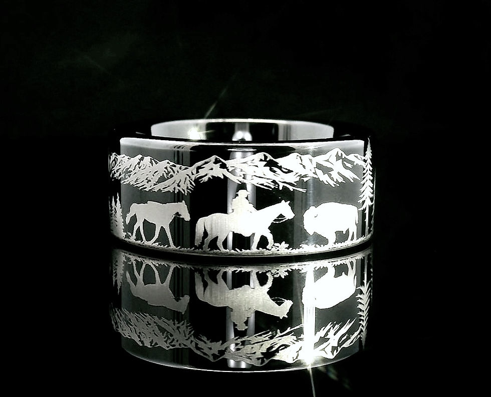 Thumbnail: Black tungsten carbide wedding band engraved with a cowboy, buffalo, and mountain range.