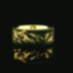 yellow gold tungsten wedding band engraved with mountain range design