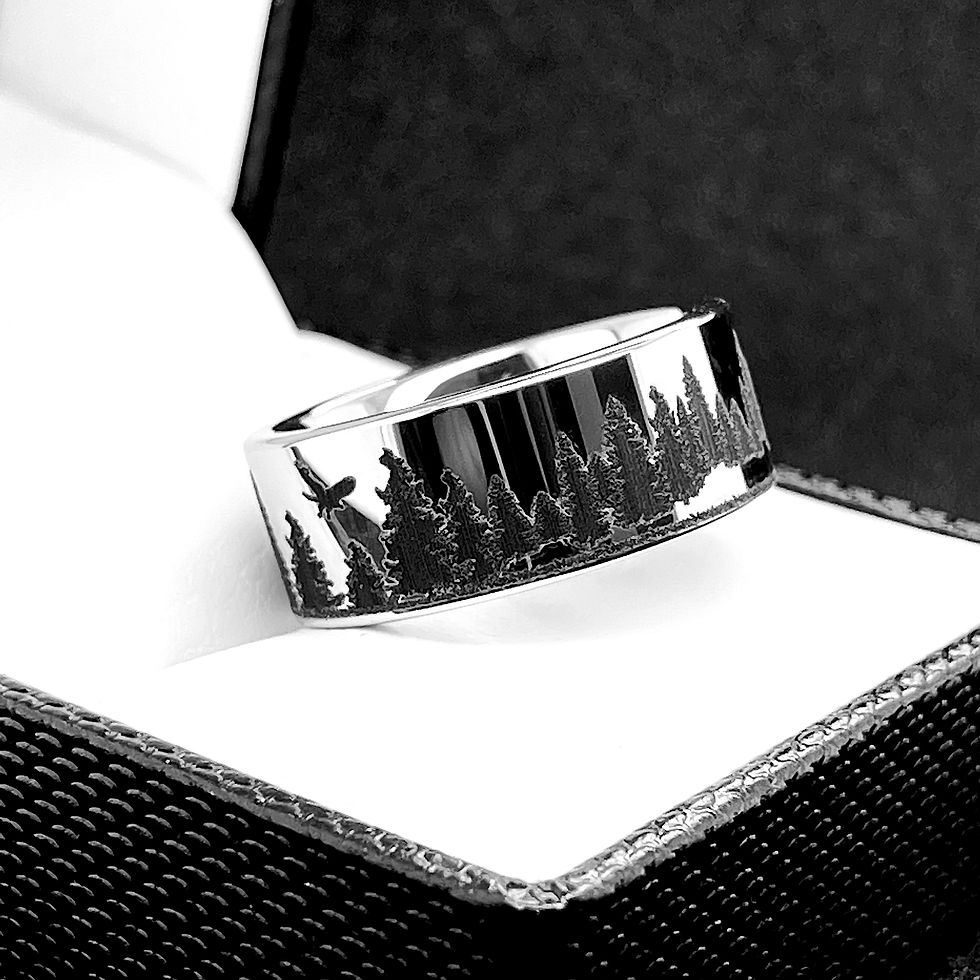 Thumbnail: Tungsten ring engraved with two bears facing each other in a mountain forest scene.