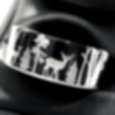 Black tungsten wedding band with engraved elk and forest scene, 8mm comfort-fit men’s nature ring.