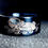 Thumbnail: Otters in River Pattern Engraved Blue Tungsten Ring, His and Her Promise Ring