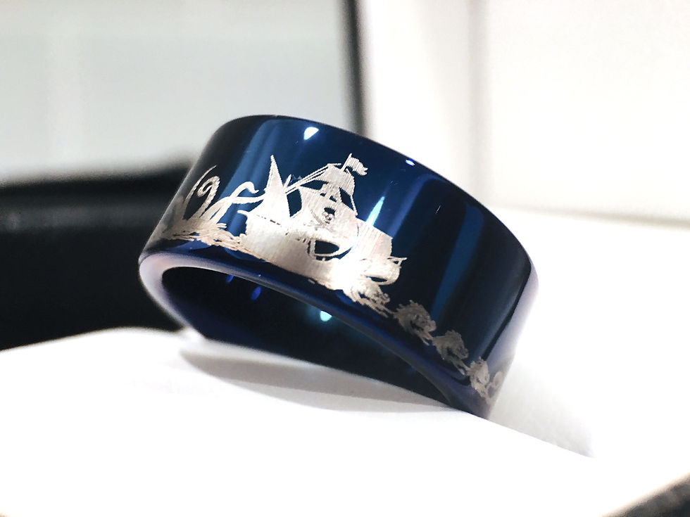 Thumbnail: Blue ungsten wedding band with pirate ship, ocean wave, and dolphin engraving, durable and scratch-resistant.