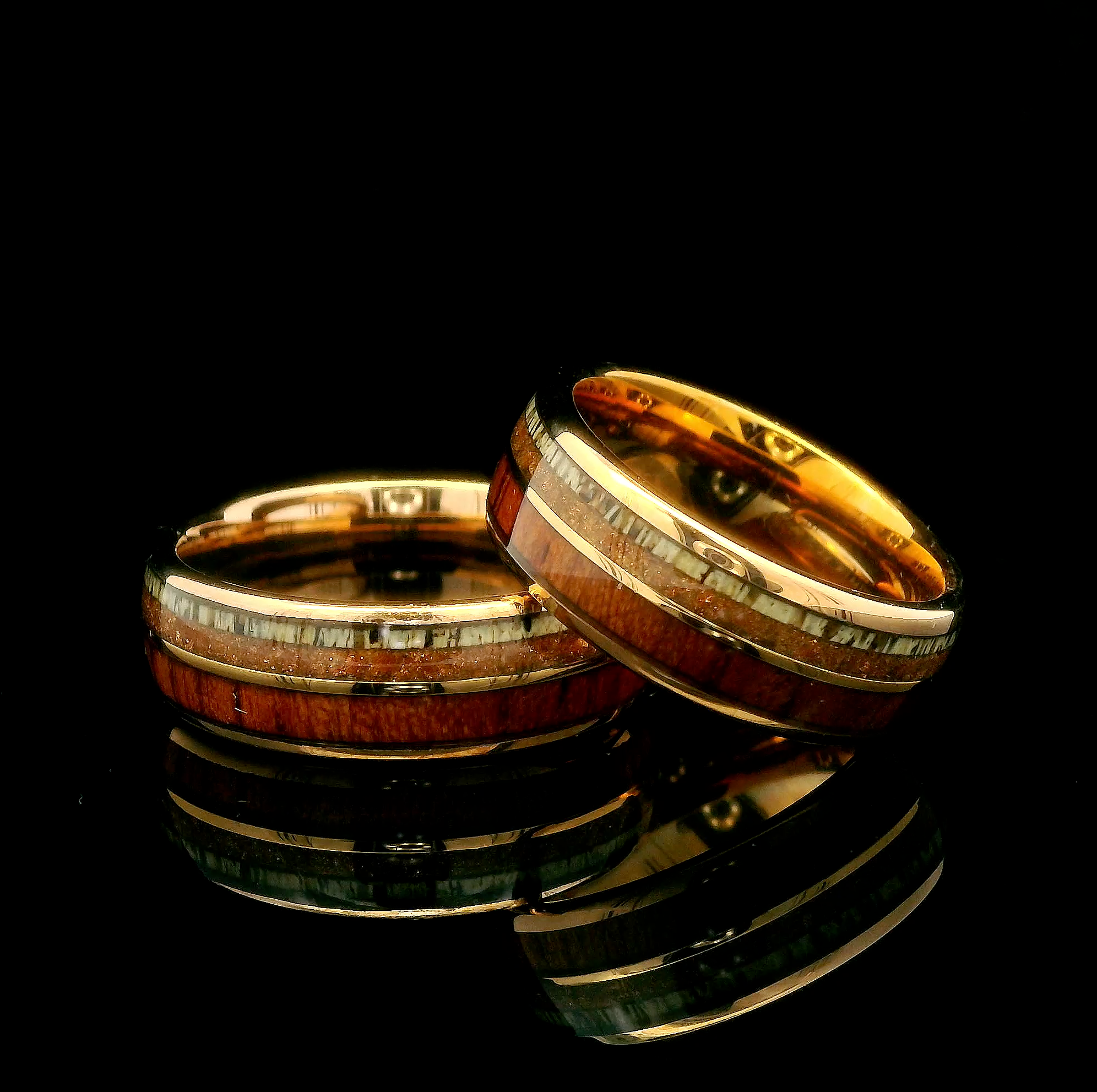 Matching couples rings set featuring aventurine, wood, and deer antler inlay in a rose gold tungsten band perfect for wedding