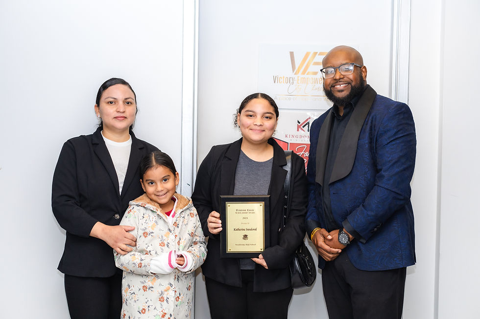 A family celebrating receiving their Scholarship award
