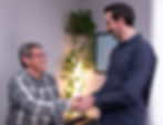 Dr. Shaun consulting with a patient at Healing Wave Chiropractic