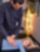 Dr. Shaun Gallagher providing gentle pediatric chiropractic care to a young boy at Healing Wave Chiropractic