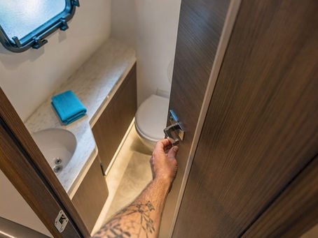 Visitor checking an enclosed boat restroom