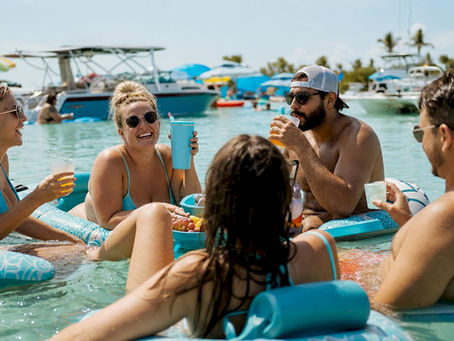 Lively floating party on Crab Island shallow waters