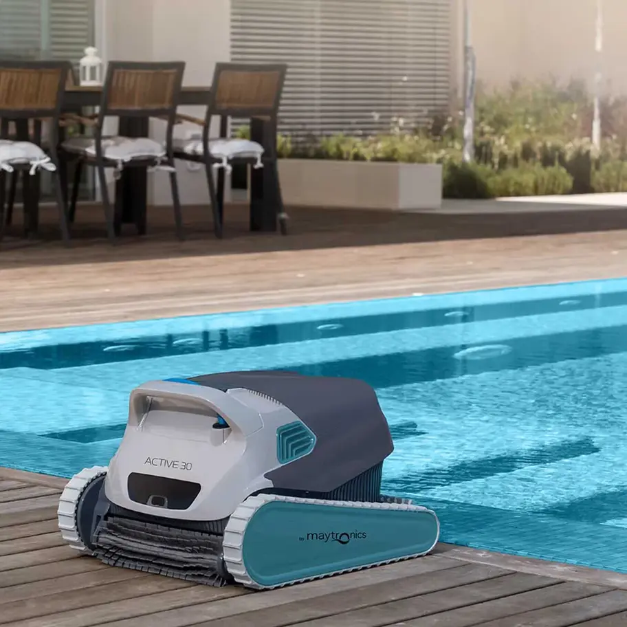 Dolphin Active 30 robotic pool cleaner beside pool in Alberta