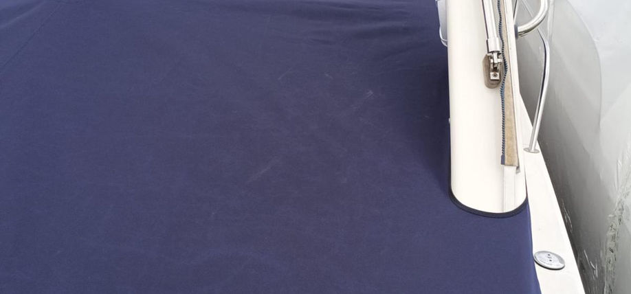 Navy blue winter boat cover on a boat