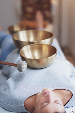 Woman having a Tibetan sound bowl massage.jpg