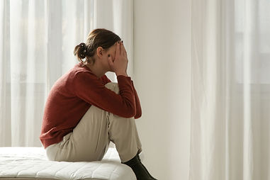 Tired, Sad, Exhausted Woman in Bed Covering Face with Hand – Depression, Insomnia, Perimen