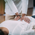 Therapist massaging woman’s back. Woman getting shiatsu back massage..jpg