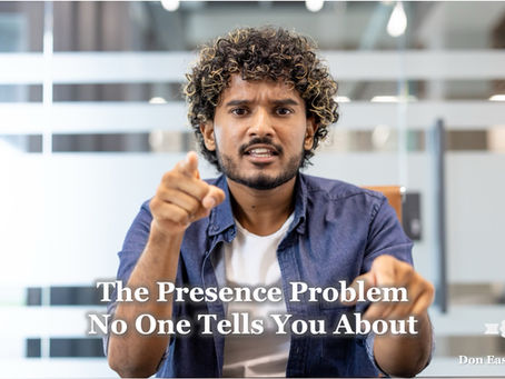 A man in a blue denim shirt leans forward at a conference table with both hands pointing directly at the camera, expression intense and urgent, glass-walled office in the background. Bold white text reads: "The Presence Problem No One Tells You About." Don Eash Coaching logo in the lower right corner.