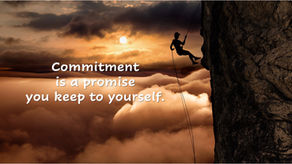 Rock climber scaling cliff above clouds at sunset representing commitment and following through