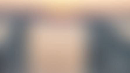 Open gates overlooking a sunset ocean vista representing curiosity as the antidote to emotional prosecution