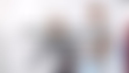 Physical therapist in white scrubs standing beside a patient who is doing leg rehabilitation exercises on his own using a knee brace and exercise equipment. The therapist observes with hands clasped but is not assisting. Text overlay: "Replace 'here's what I'd do' with 'what are you thinking?' Then be quiet." Don Eash Coaching logo in bottom right corner.