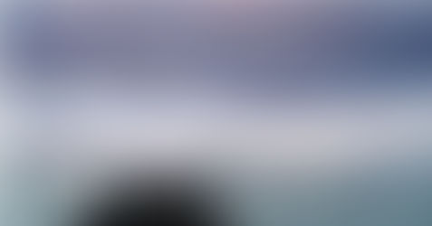 Person standing on rocky cliff overlooking ocean at dusk with text overlay: The Altitude Problem — Why Your Best Leaders Are Stuck