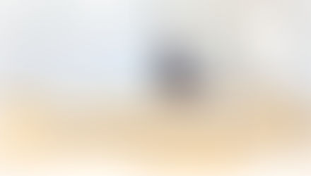   A professional photograph of a suited man standing alone at a podium with a laptop in a large, empty conference room filled with rows of vacant tan chairs. Bold dark navy text in the lower left reads: "Your Work Doesn't Speak for Itself." The Don Eash Coaching logo appears in the lower right corner in white.