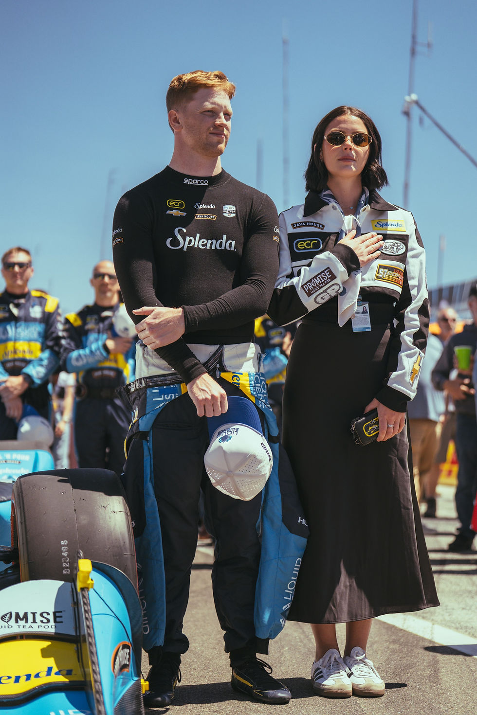 Pictured (left to right) Indycar driver Christian Rasmussen with partner and former racing driver, Maria Cofer, wearing a custom GP Moto Jacket at the Java House Grand Prix of Monterey.