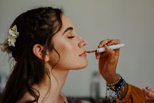 Bride getting her makeup done before her wedding in Madrid.
