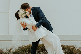 Romantic couple embracing and kissing during Madrid elopement photoshoot.