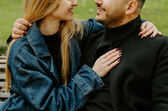 Couple pose laughing for engagement session after a surprise proposal in Campo del Moro gardens, Madrid