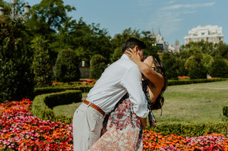 Couple share a passionate kiss at their engagement photoshoot in Madrid.