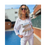 Miniatura: Modelo con blusa blanca y pantalones blancos
