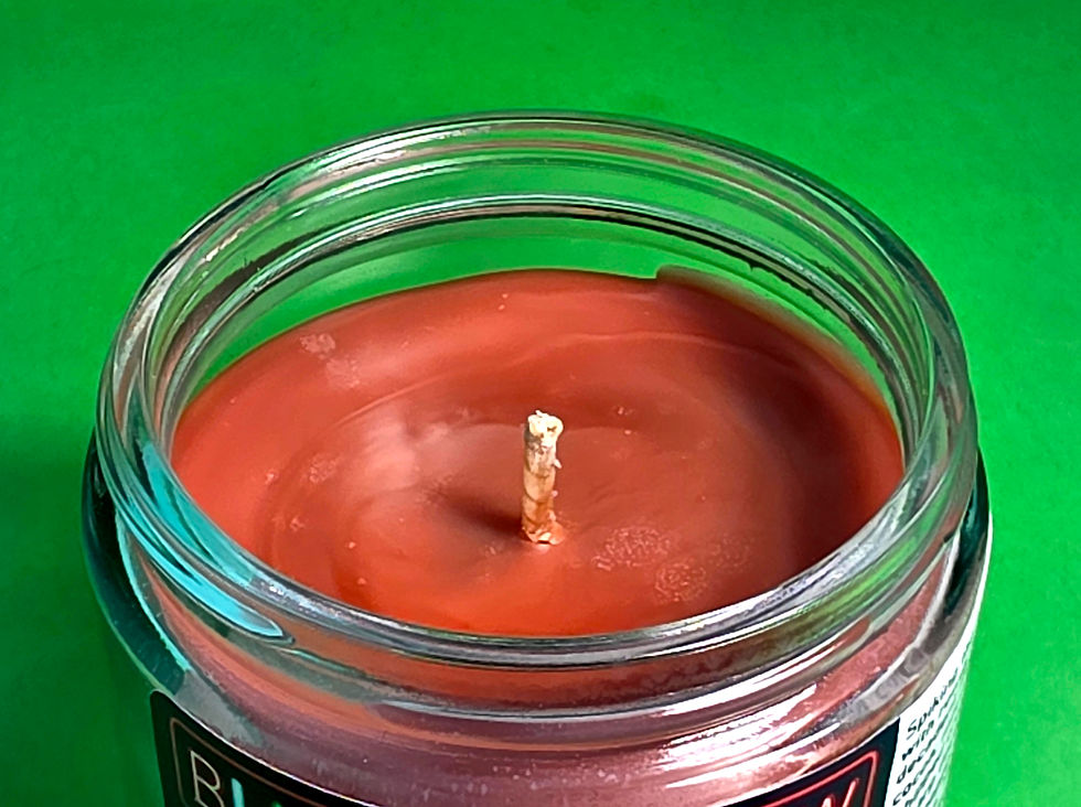 Thumbnail: brown candle on green background