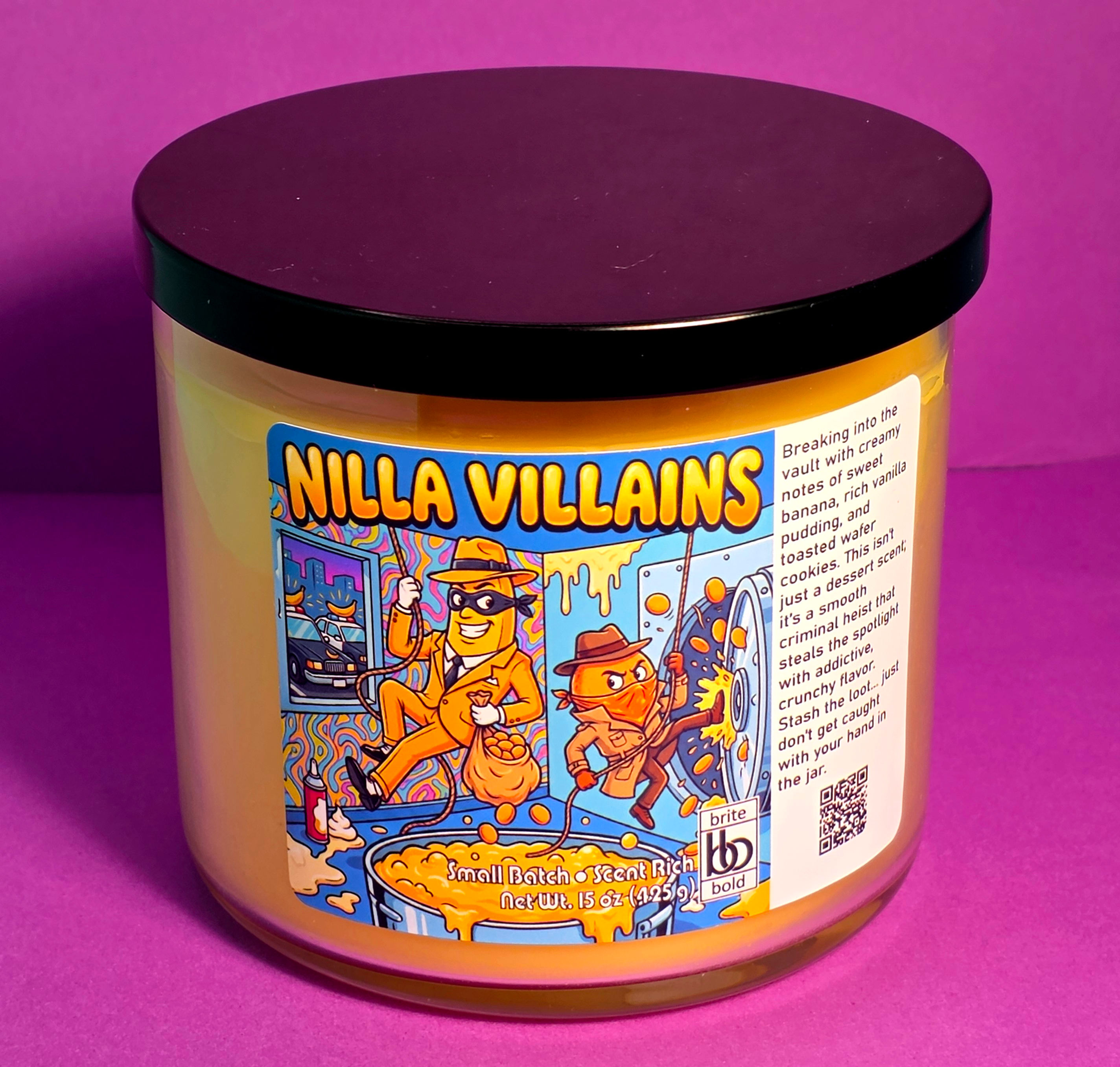 large yellow candle on purple table