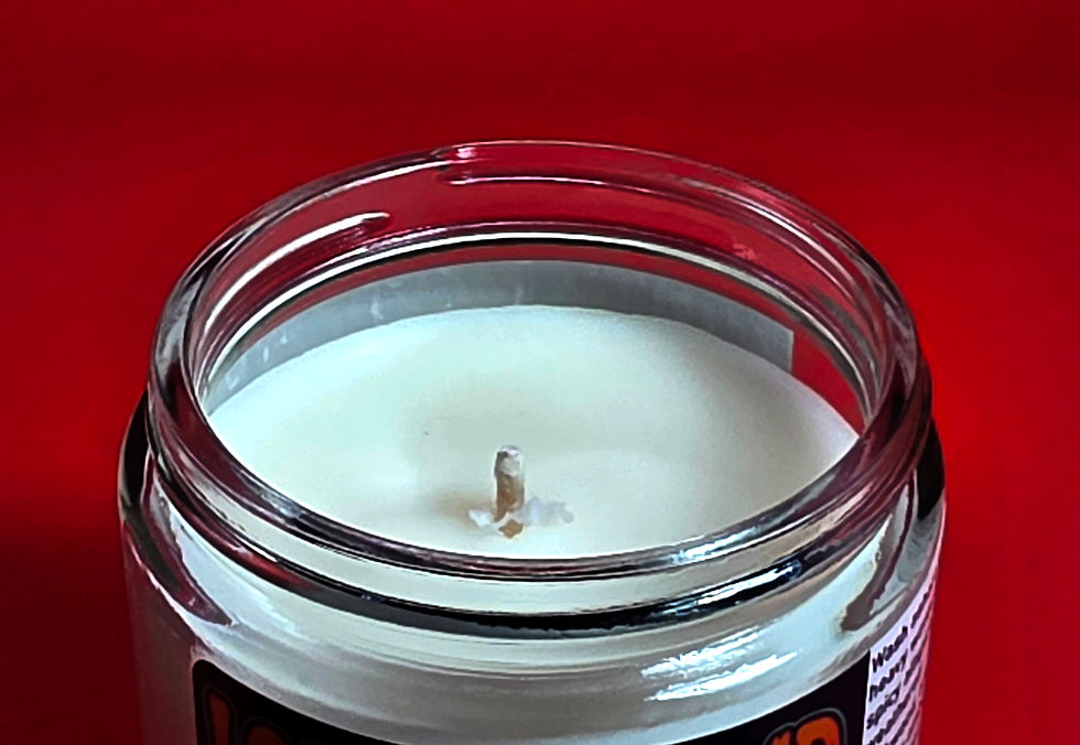 Thumbnail: white candle on red table