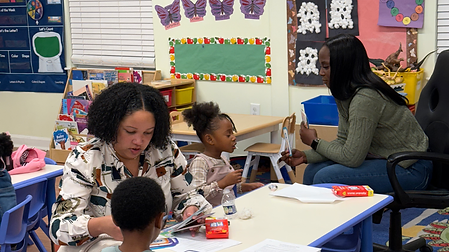 Teachers reading with children.