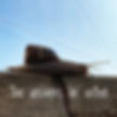 Snail on a wooden surface under a clear blue sky. Text reads "The answers lie within," conveying a reflective mood.