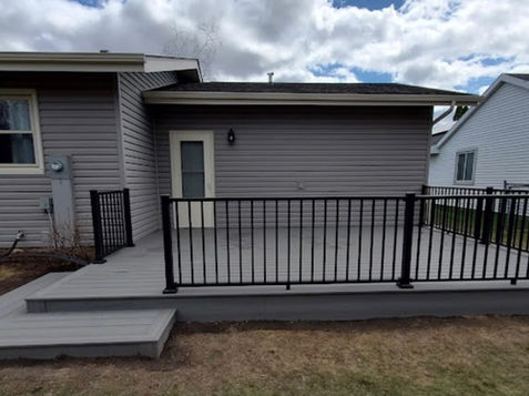 Custom Built Deck with Railings and Step-Down Entry into Yard