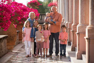 many children with grandparents standing together