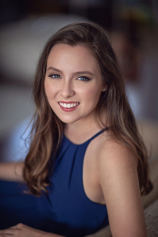 girl in blue dress msiling