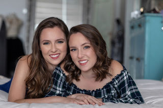 sisters smiling together